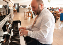 wedding guest playing piano