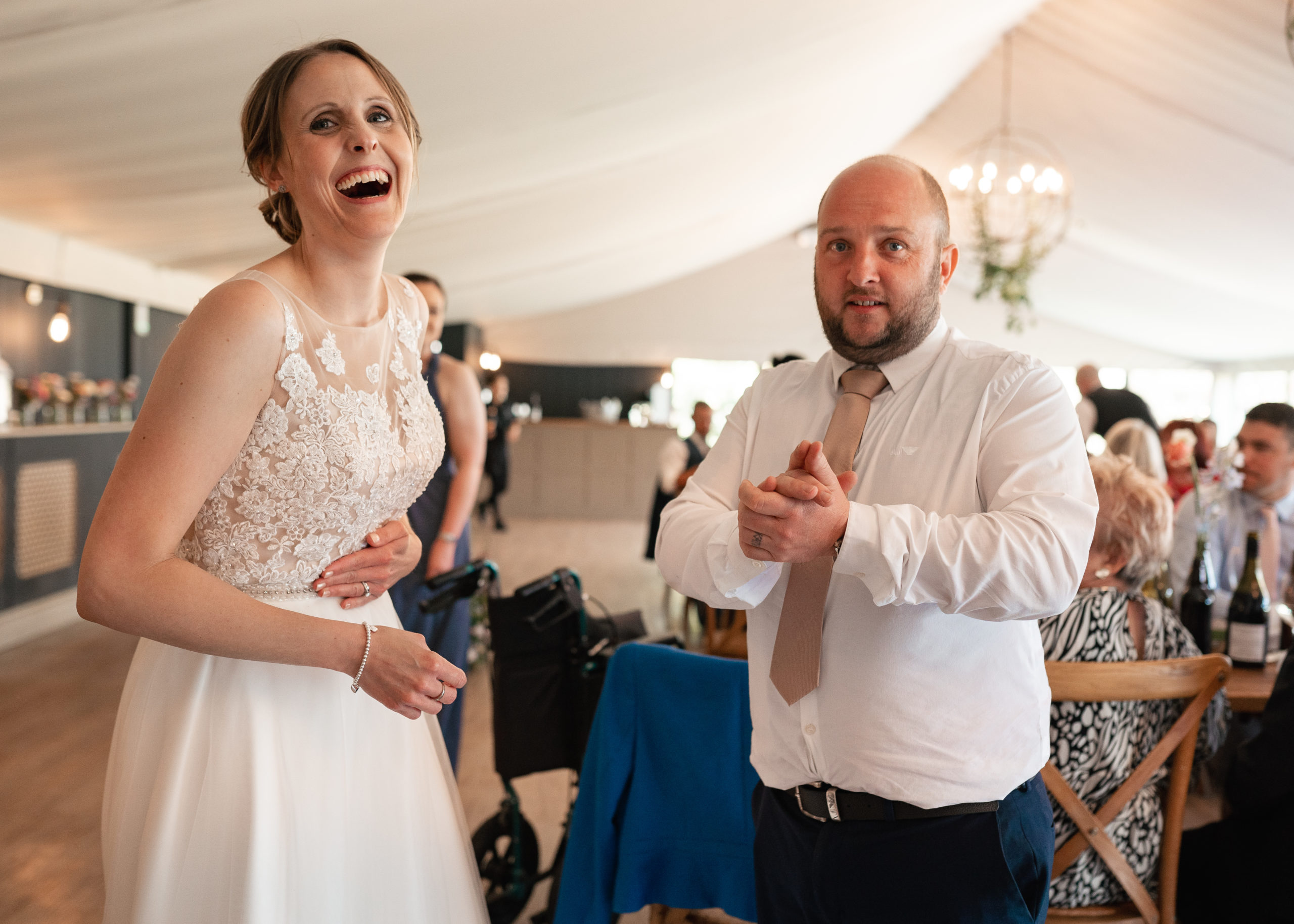 bride laughing with guest
