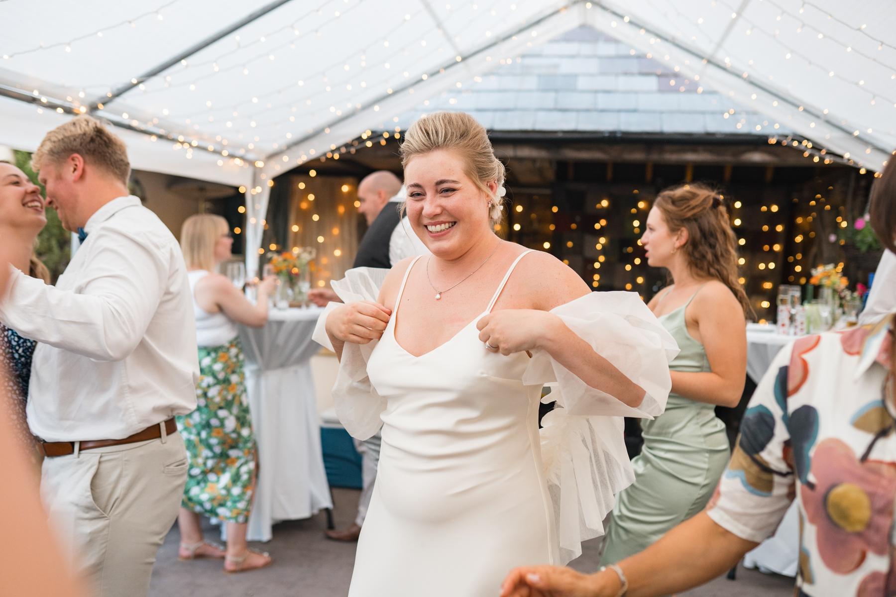bride laughs on dancefloor