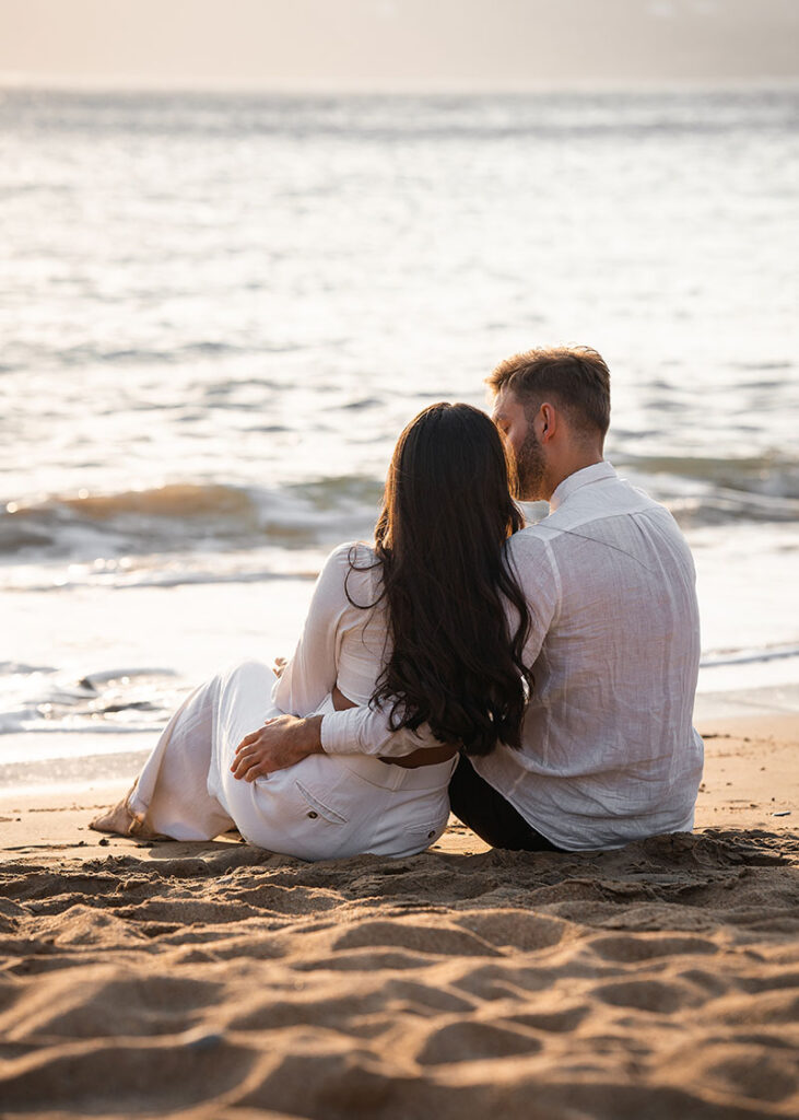 could cuddle at the waters edge during beach  engagement shoot in greece