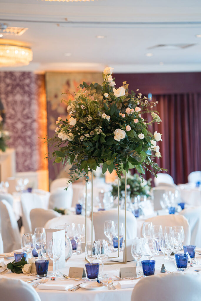 large floral display in reception room at chewton glen wedding
