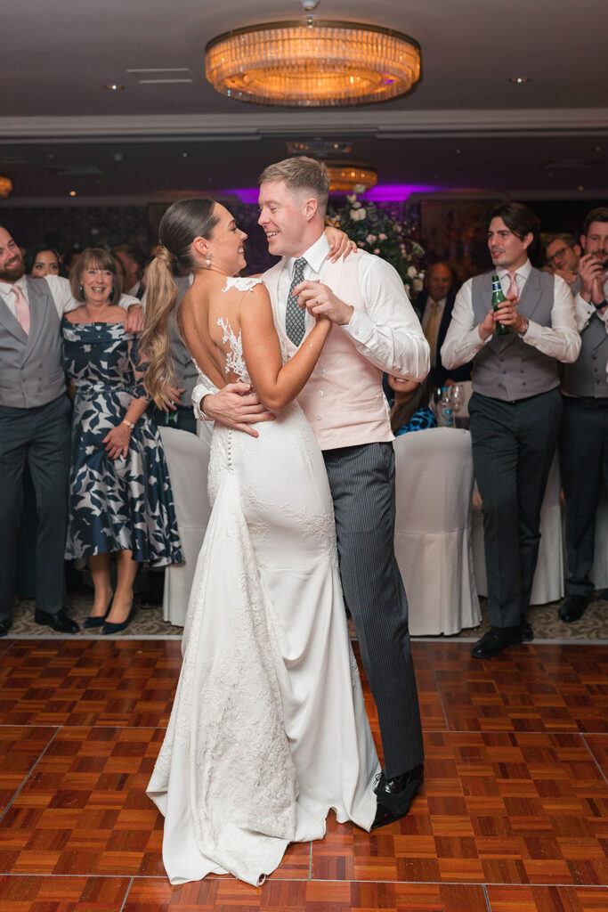 Bride and Groom embrace on the dancefloor at Chewton Glen Wedding
