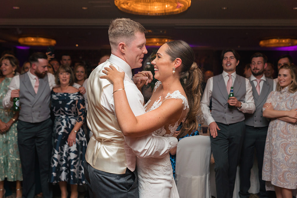 Bride and Groom embrace on the dancefloor at Chewton Glen Wedding