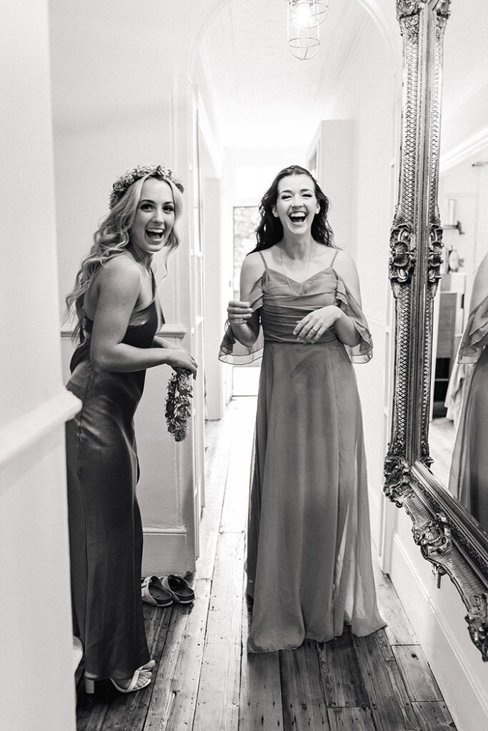 bridesmaids getting ready, laughing
