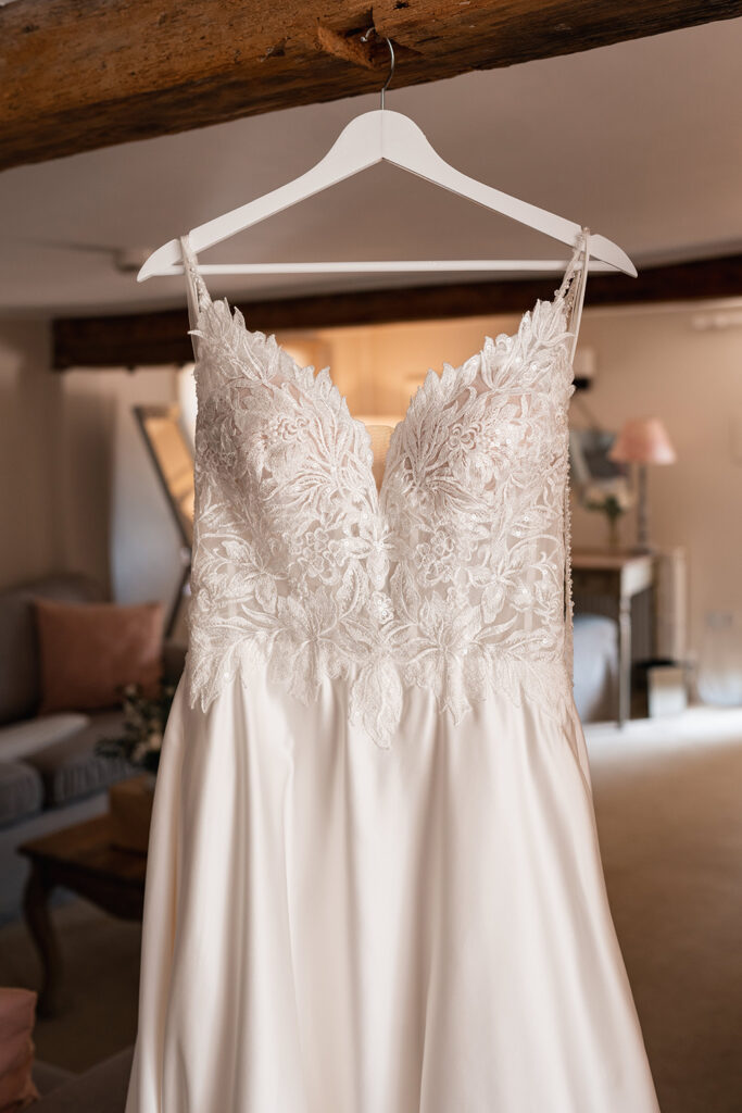 dress hanging in the Avon Suite at Sopley Mill Summer Wedding