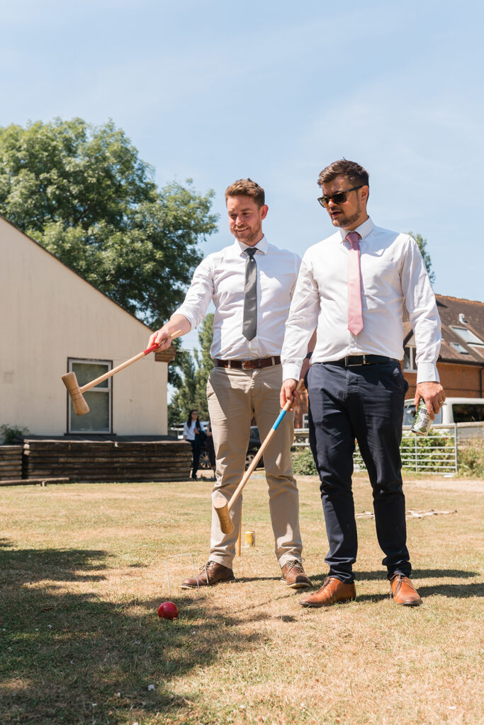 Guests at eco-friendly wedding play with handmade garden games