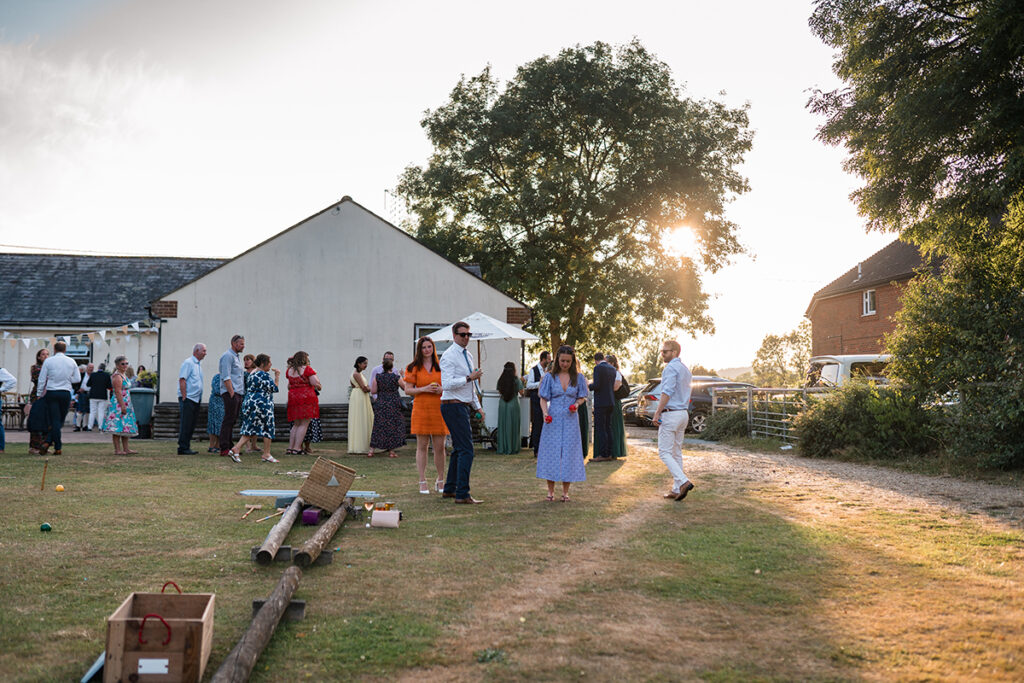 Guests at eco-friendly wedding play with handmade garden games