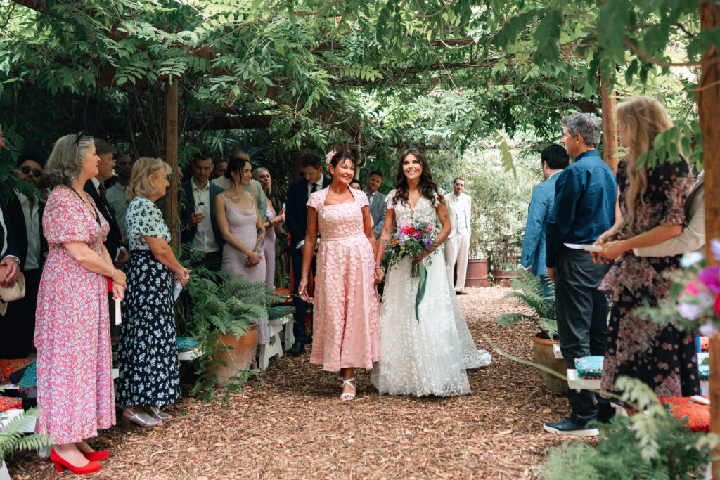 Bride walks down aisle with mum at Harewood Forest 