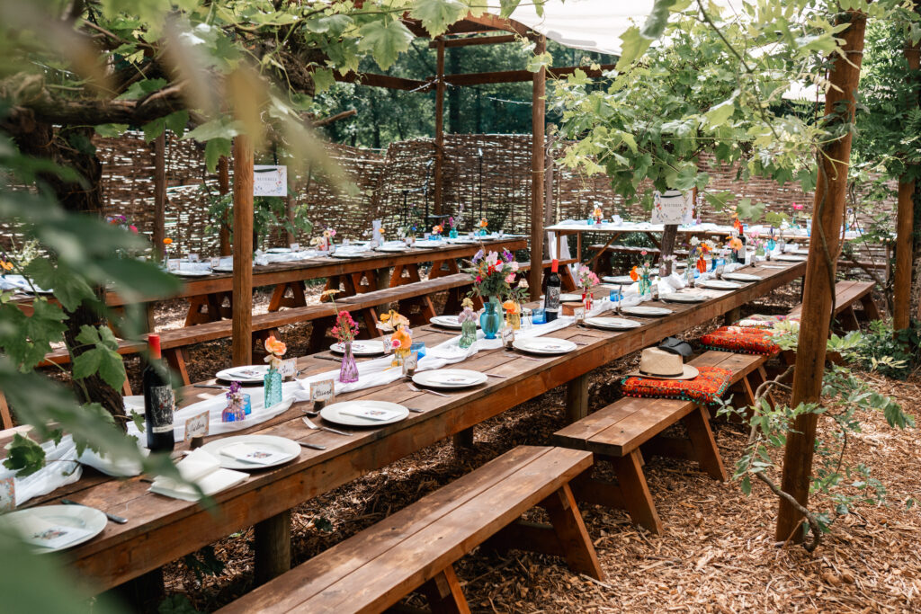 Harewood Forest wedding breakfast area display with colourful bud vases