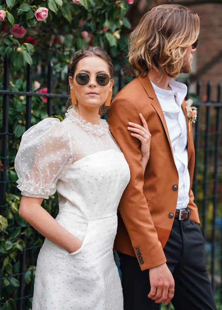 stylish couple side by side at London wedding