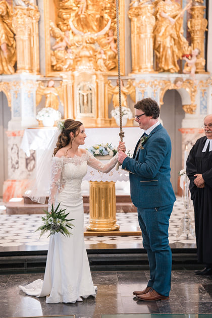 Couple ring the wedding bell at Lake Bled Church
